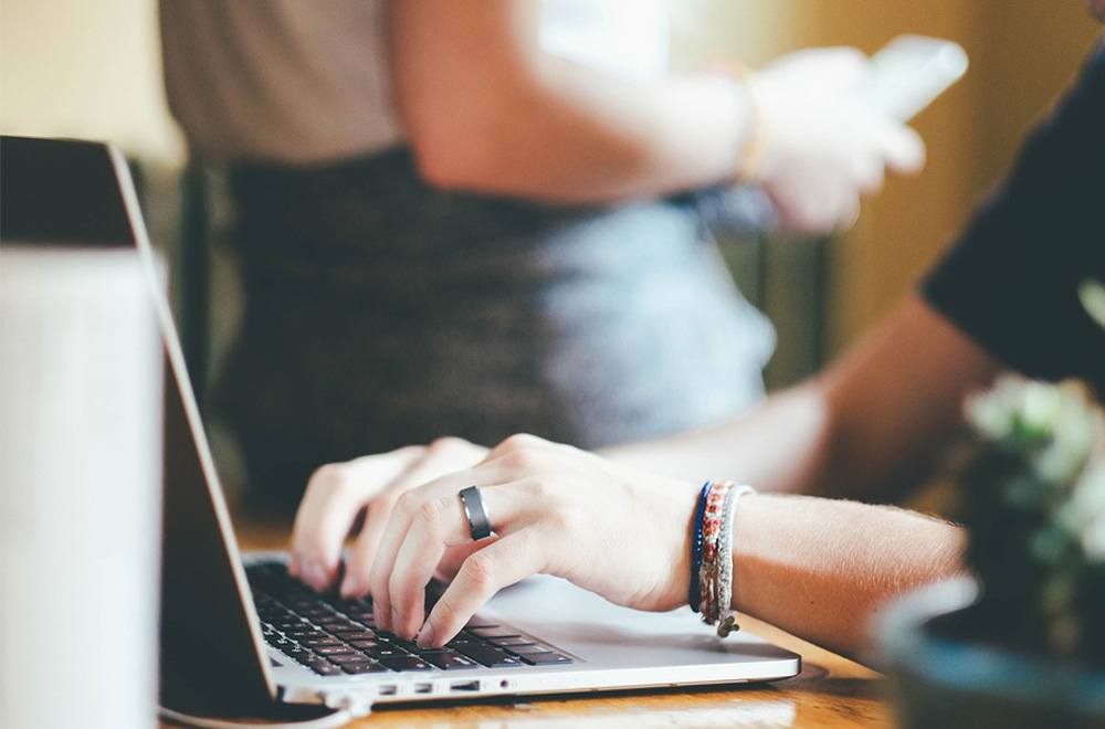 person doing research on laptop