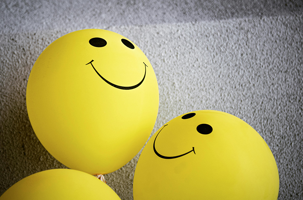 yellow balloons with smiley faces 