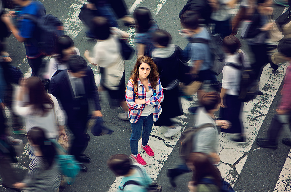 woman surrounded by other people