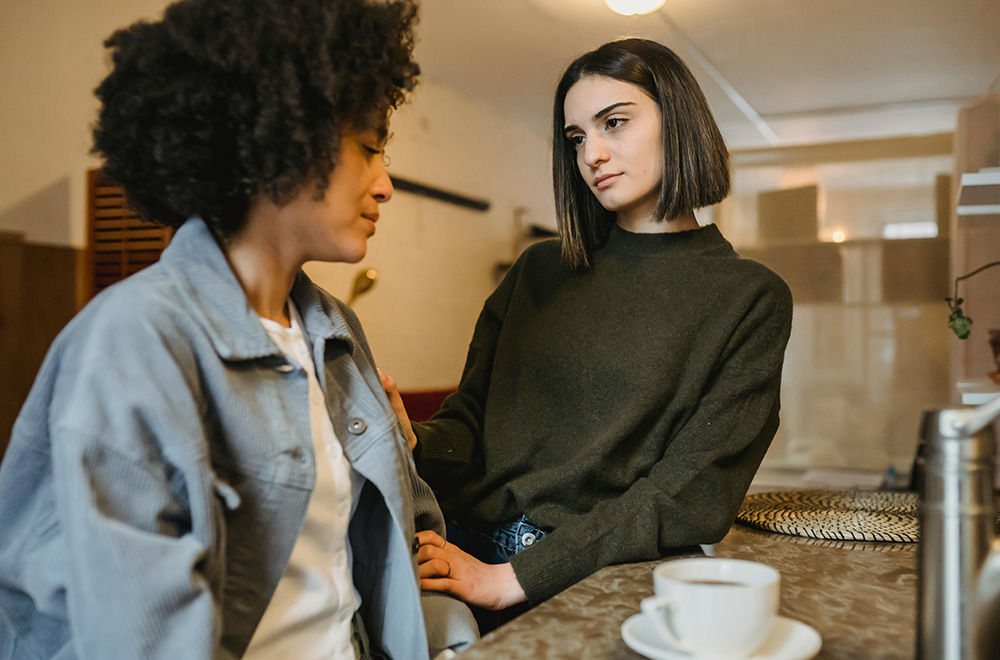 woman supporting friend