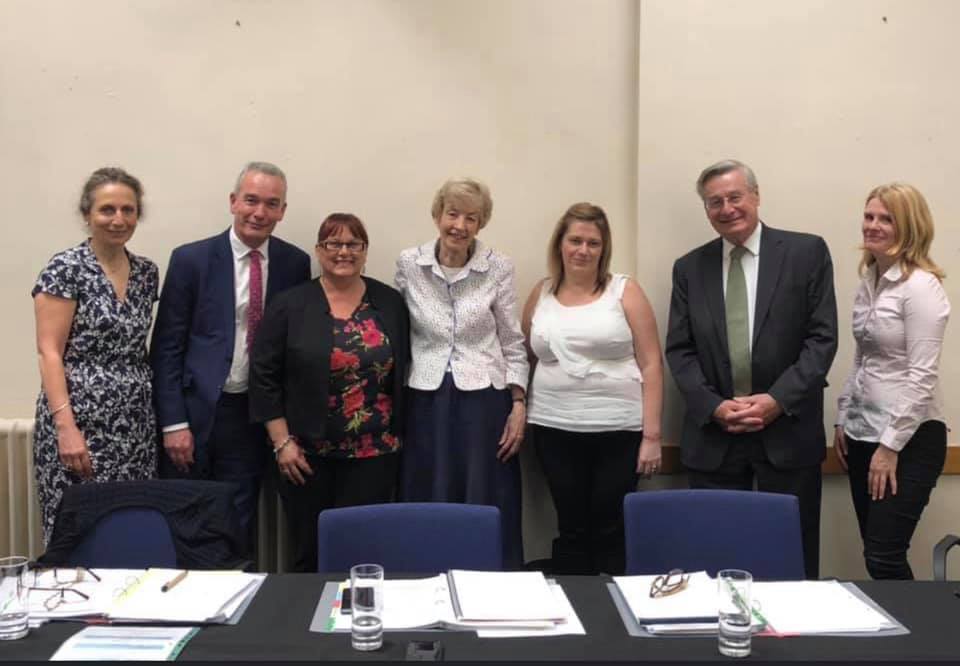 Janet Williams (left) and Emma Murphy standing either side of Baroness Cumberlege with the Review team.