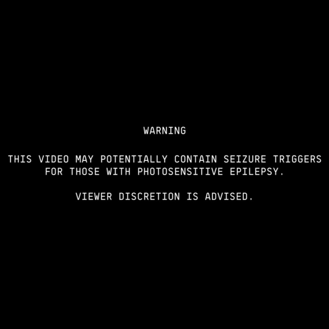 Warning on Beyonce video about photosensitive content. White on black.