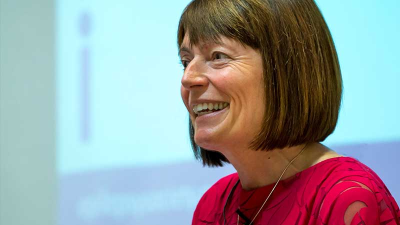 Smiling woman giving lecture