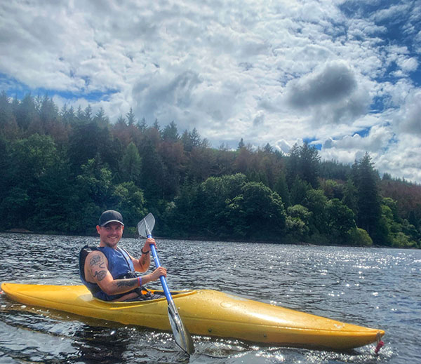 Dan canoeing on a lake