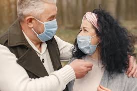 Man and women with masks