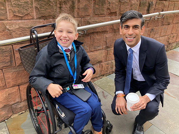 Campaigner Zach meets Rishi Sunak when he was Chancellor. They are both smiling at the camera