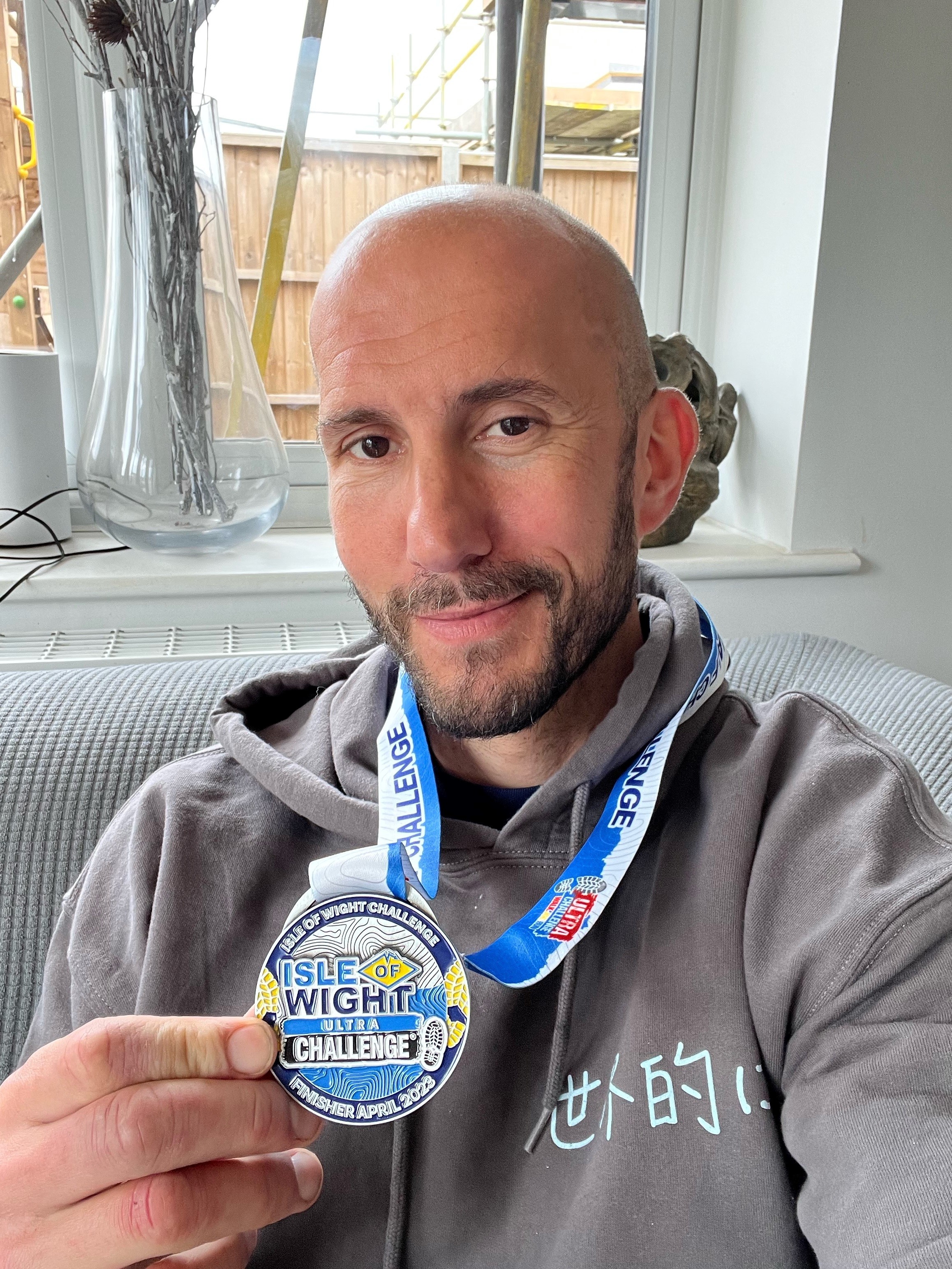 Ryan Tindall with marathon medals