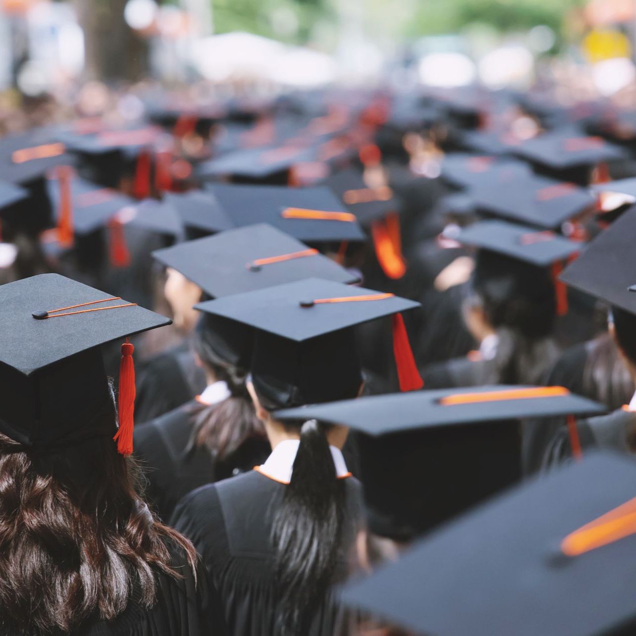 Students at university wearing mortarboard hats