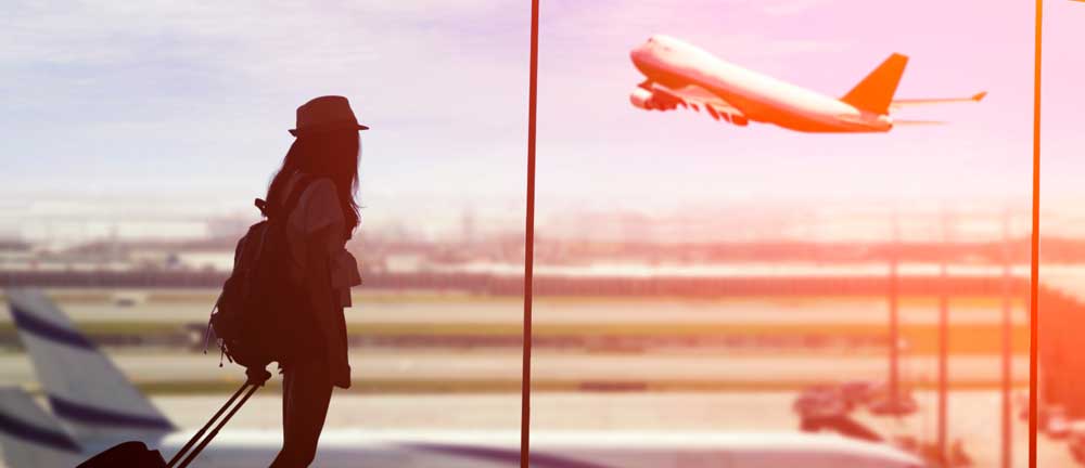 A young lady getting ready to travel by plane