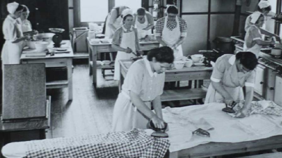A group of women ironing