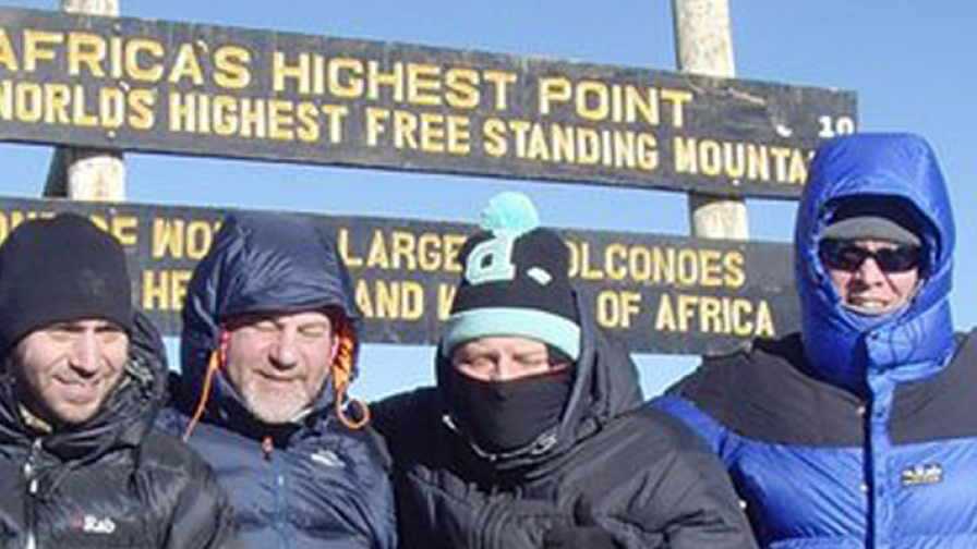 A group of supporters climbing Kilimanjaro