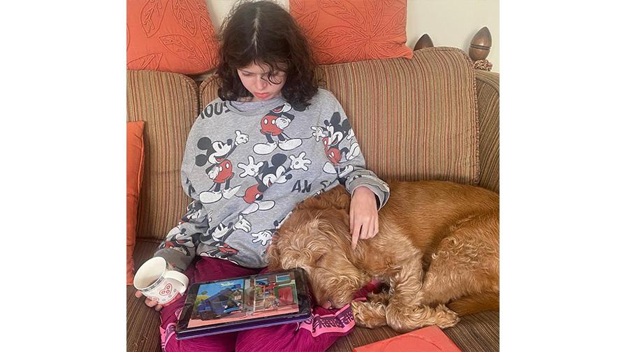 Ella sitting with her dog