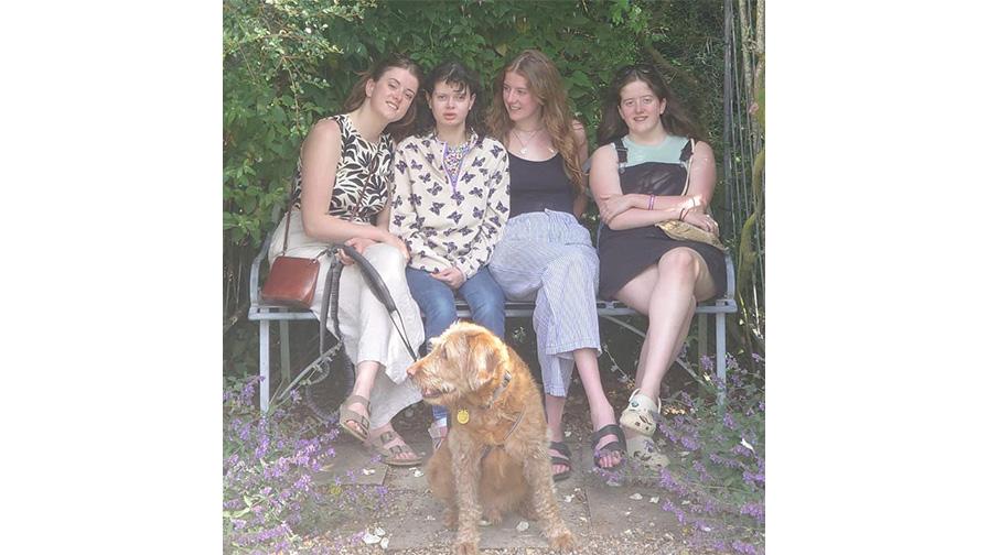 Ella sitting in group with dog