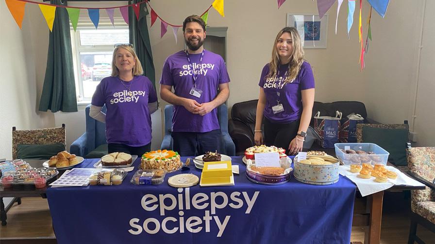 people fundraising at cake sale