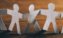 paper people holding hands